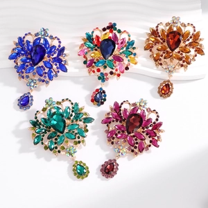 Elegant vintage crystal flower brooches with water drop pendants in various vibrant colors