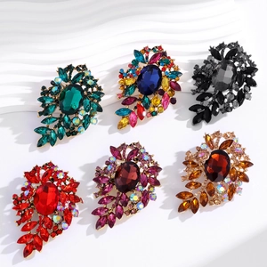 Set of six vintage crystal flower brooches with colorful rhinestones in gold setting