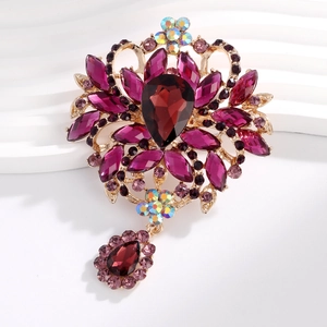 Exquisite gold brooch with royal purple teardrop gemstones and sparkling crystal accents