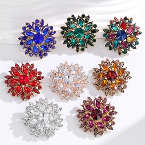 Vintage flower brooches set with colorful rhinestones in multiple vibrant styles