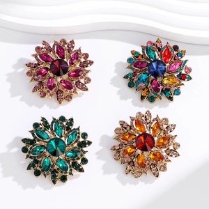 Vintage floral crystal brooches in four colors with sparkling rhinestones and gold plating