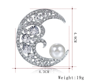 Detail showing dimensions 4.9cm by 4.3cm of crescent moon pearl brooch with rhinestones