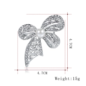 Bowknot crystal brooch with white pearl in silver finish, 4.7cm x 4.7cm design