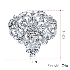 Vintage silver heart brooch with clear rhinestones and size dimensions 5.6cm by 5.4cm