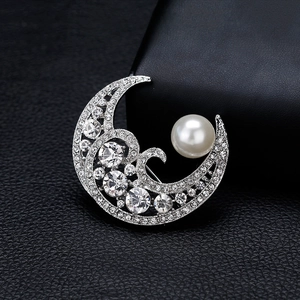 Silver crescent moon brooch with large white pearl and sparkling round zircon stones
