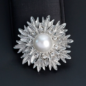 Elegant silver alloy floral brooch with a large white pearl and sparkling crystals