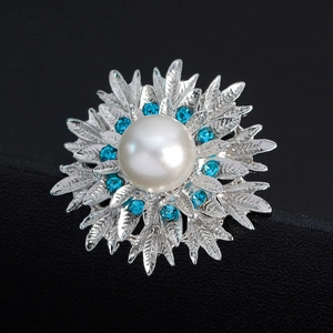 Elegant vintage floral brooch with white pearl, blue rhinestones and silver alloy petals