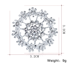 Close-up of snowflake crystal brooch with silver plating and rhinestones measuring 3.2cm