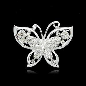 Silver butterfly brooch pin with sparkling crystal rhinestones on a black background
