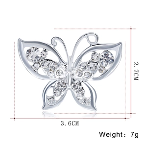 Elegant silver butterfly brooch with white crystals and hollow wings, 3.6cm by 2.7cm