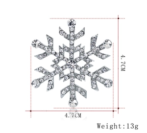 Détails de la broche flocon argentée avec dimensions 4,7 cm et poids de 13 g