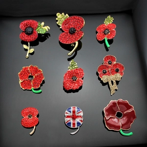 Detailed macro view of crystal poppy brooches with enamel petals and British Union Jack design