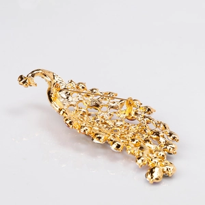Back view of oversized colorful crystal peacock brooch with gold pin fastener