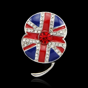 Close-up of poppy flower brooch with British flag pattern and sparkling rhinestones