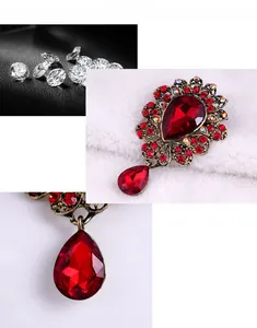 Macro detail of luxury vintage brooch with red teardrop crystal and antique gold base