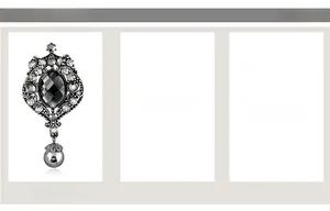Detail of antique silver brooch with black crystal and grey pearl drop