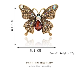 Detailed macro view showing a vintage crystal butterfly brooch with 5.1cm by 3.9cm dimensions