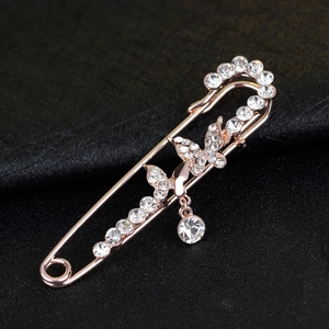 Luxury rose gold double butterfly brooch with sparkling crystals and a round diamond pendant