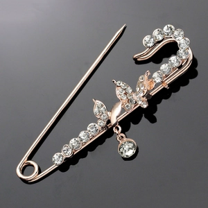 Luxury rose gold safety pin brooch with sparkling butterfly accents and clear rhinestones