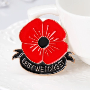 Poppy enamel brooch with 'Lest We Forget' ribbon and rhinestones on white ceramic