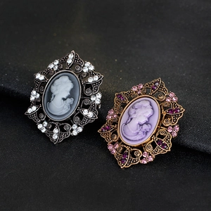 Vintage relief portrait brooches with baroque hollow design and crystal accents