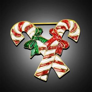 Christmas candy cane brooch with red and white enamel stripes on a gold metal base