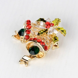 Golden Christmas bells brooch with green gems and red rhinestones for festive outfits