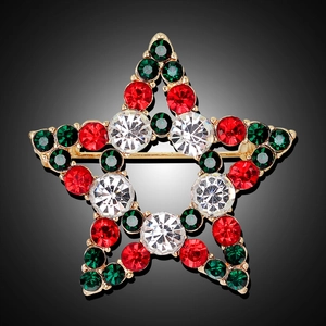 Christmas star brooch with red green and white rhinestones on a gold plated base