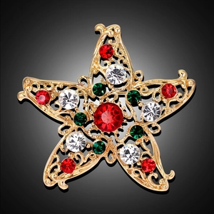Goldene Weihnachts-Sternbrosche mit funkelnden roten, grünen und klaren Kristallen