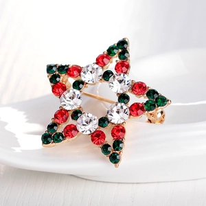 Elegant Christmas star brooch with red, green, and clear crystals on gold base