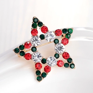 Christmas star brooch with red and green rhinestones on a gold metal base