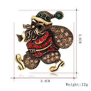 Detailed view of vintage Santa Claus brooch with rhinestones including size dimensions