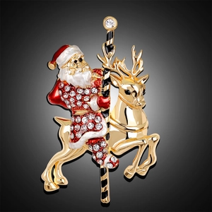 Golden Santa Claus and reindeer carousel brooch with sparkling white rhinestones