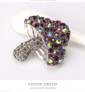 Detailed view of mushroom brooch with purple and AB crystal rhinestones on a vintage base