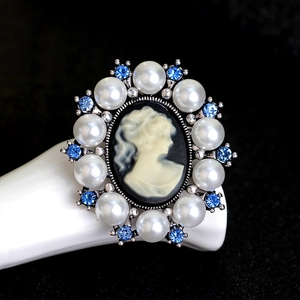Vintage Victorian cameo ring with white pearls and blue rhinestones on a silver base