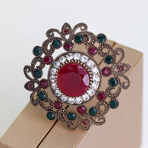 Vintage luxury镂空 brooch with red gemstone and crystal rhinestones in bronze finish