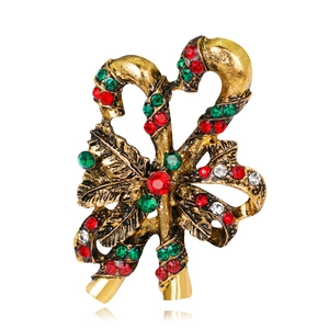 Detailed macro view of Christmas candy cane brooch with red and green rhinestones