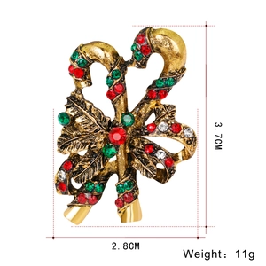 Detail of Christmas candy cane brooch with colorful rhinestones and dimensions 3.7x2.8cm