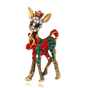 Detailed view of a Christmas reindeer brooch with vintage gold alloy and colorful rhinestones