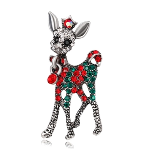 Close-up of a festive Christmas reindeer brooch with colorful rhinestones and red heart