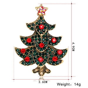Detail of Christmas tree brooch with green and red rhinestones, size 4.9cm by 3.6cm