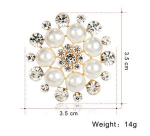 Detail view of round pearl brooch with sparkling rhinestones, 3.5 cm x 3.5 cm