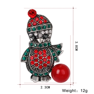 Detailed view of penguin Christmas brooch with size 3.8cm x 2.3cm and rhinestones
