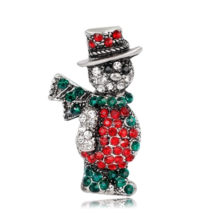 Detailed view of snowman Christmas brooch with red and green sparkling crystals