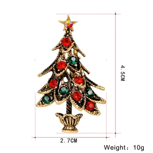 Vintage bronze Christmas tree brooch with colorful rhinestones and gold star detail