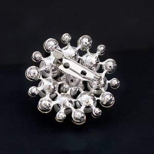 Elegant floral pearl brooch with silver alloy base and secure back pin closure