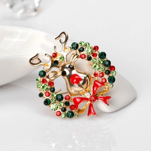 Broche de renne de Noël avec strass colorés et nœud rouge sur base en alliage doré