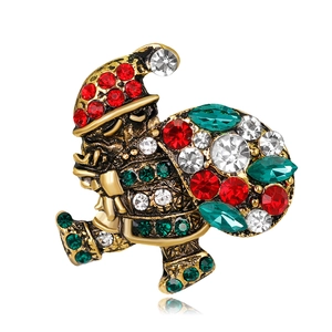 Festive Christmas brooch featuring a Santa Claus figure with colorful crystal inlays