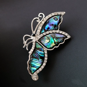 Elegant silver butterfly brooch with colorful abalone shell inlay and sparkling rhinestones