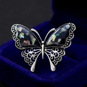 Exquisite butterfly brooch with abalone shell inlays and filigree metal wings